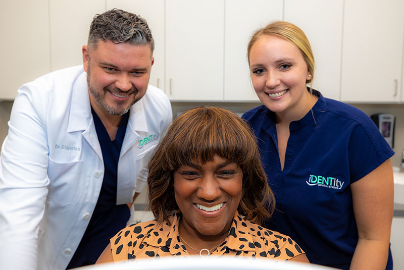 Dr. stapelont smiling with dental implant patient